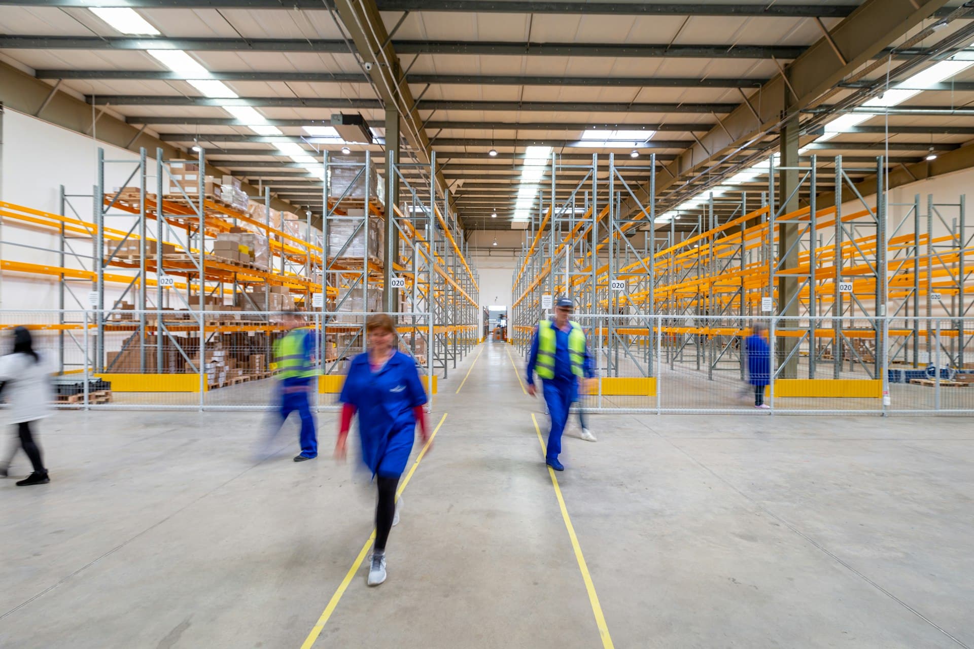Decommissioning crew clearing a warehouse floor
